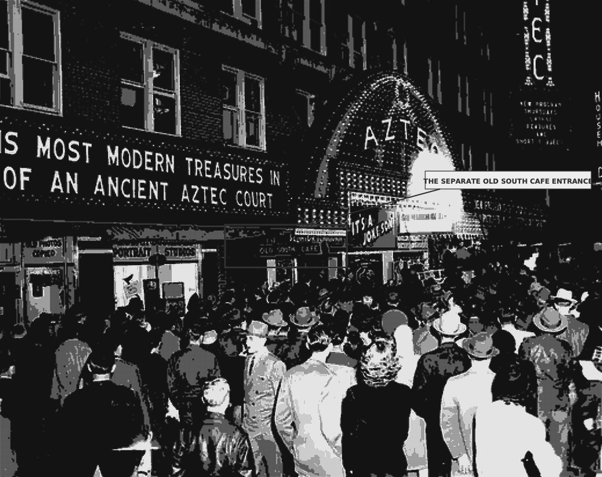 Archival photograph of a crowd beneath the lit marquee of the Aztec Theatre